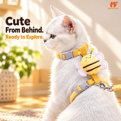 Close-up of plush bee decoration on yellow cat harness
