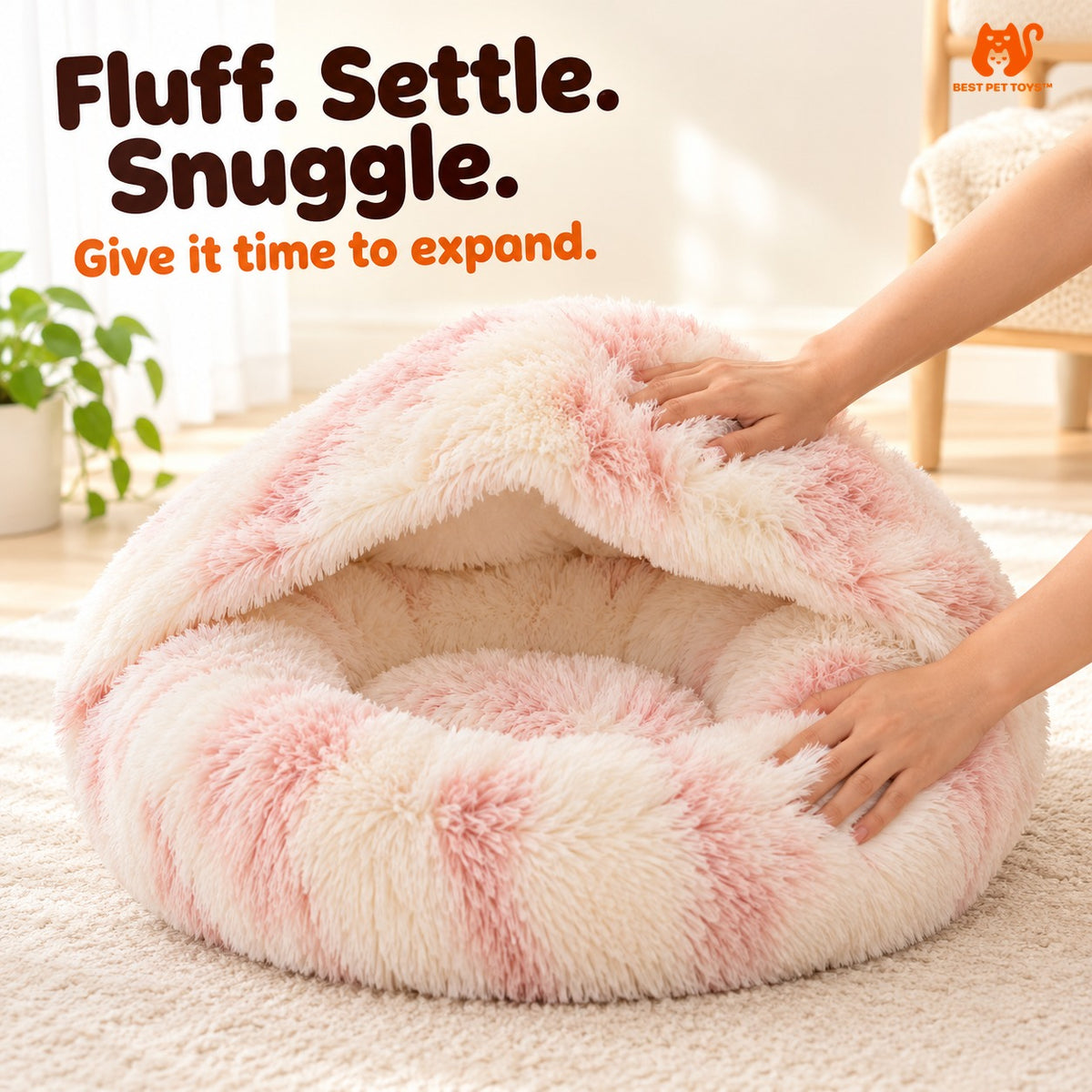Pink cat bed being fluffed after unpacking